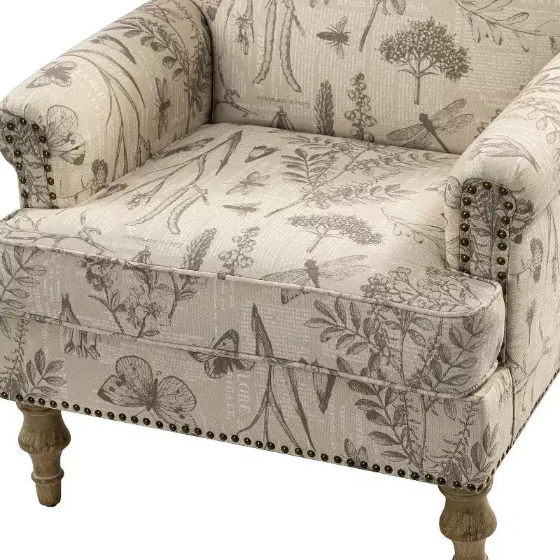 Gepolsterter Sessel aus Holz mit Blumenmuster, Paneel-Armlehnen und Kamelrückenlehne