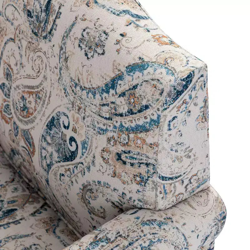 Gepolsterter Sessel aus Holz mit Blumenmuster, Paneel-Armlehnen und Kamelrückenlehne