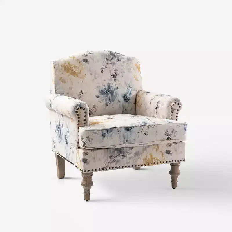 Gepolsterter Sessel aus Holz mit Blumenmuster, Paneel-Armlehnen und Kamelrückenlehne